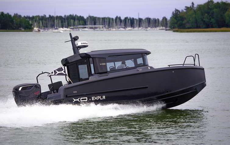 XO EXPLR 9 cabin boat under way with a Cox 300 diesel outboard