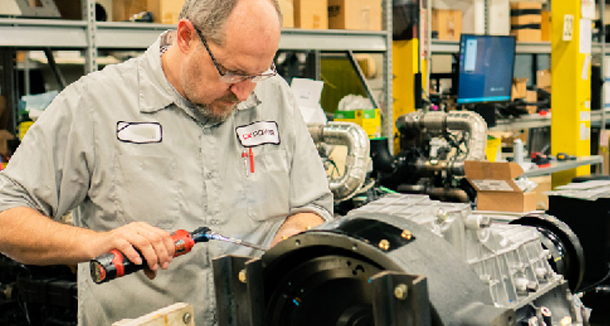 CK Power technician working on a power unit in the workshop