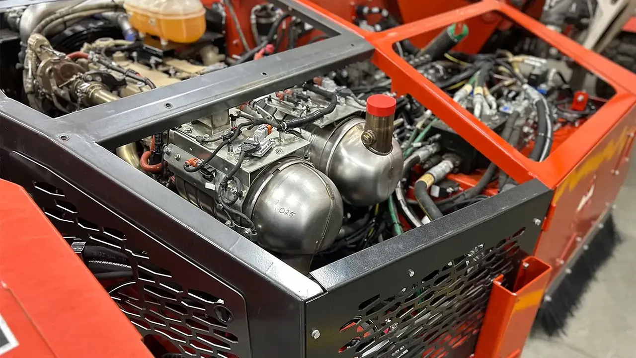 Engine and supporting components integrated into Flory’s red machine chassis