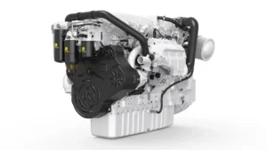 Diesel engine assembly with black belt cover, chrome pipes, and John Deere filter canisters, viewed from the front-left side.